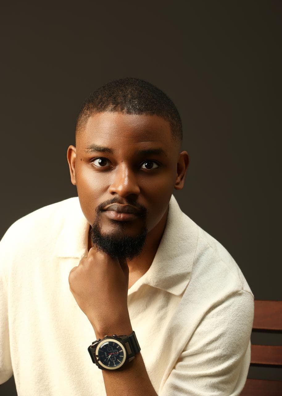 Kehinde Abiuwa resting his chin on his fist